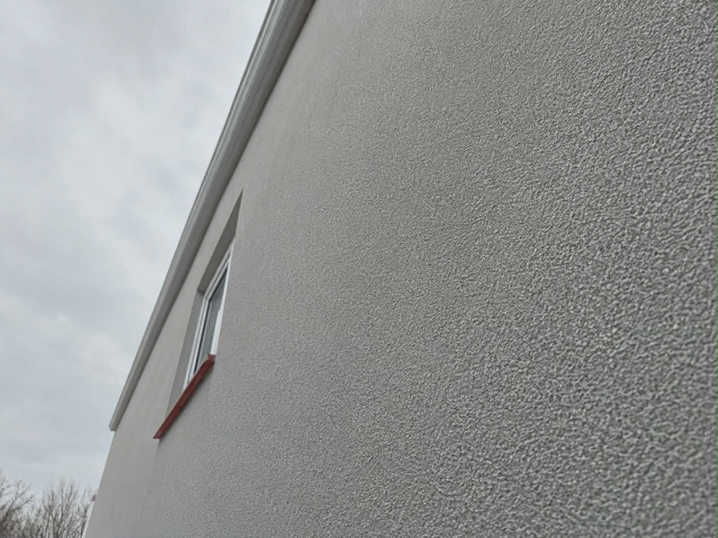 Spray Cork Render applied to an exterior property in Basildon