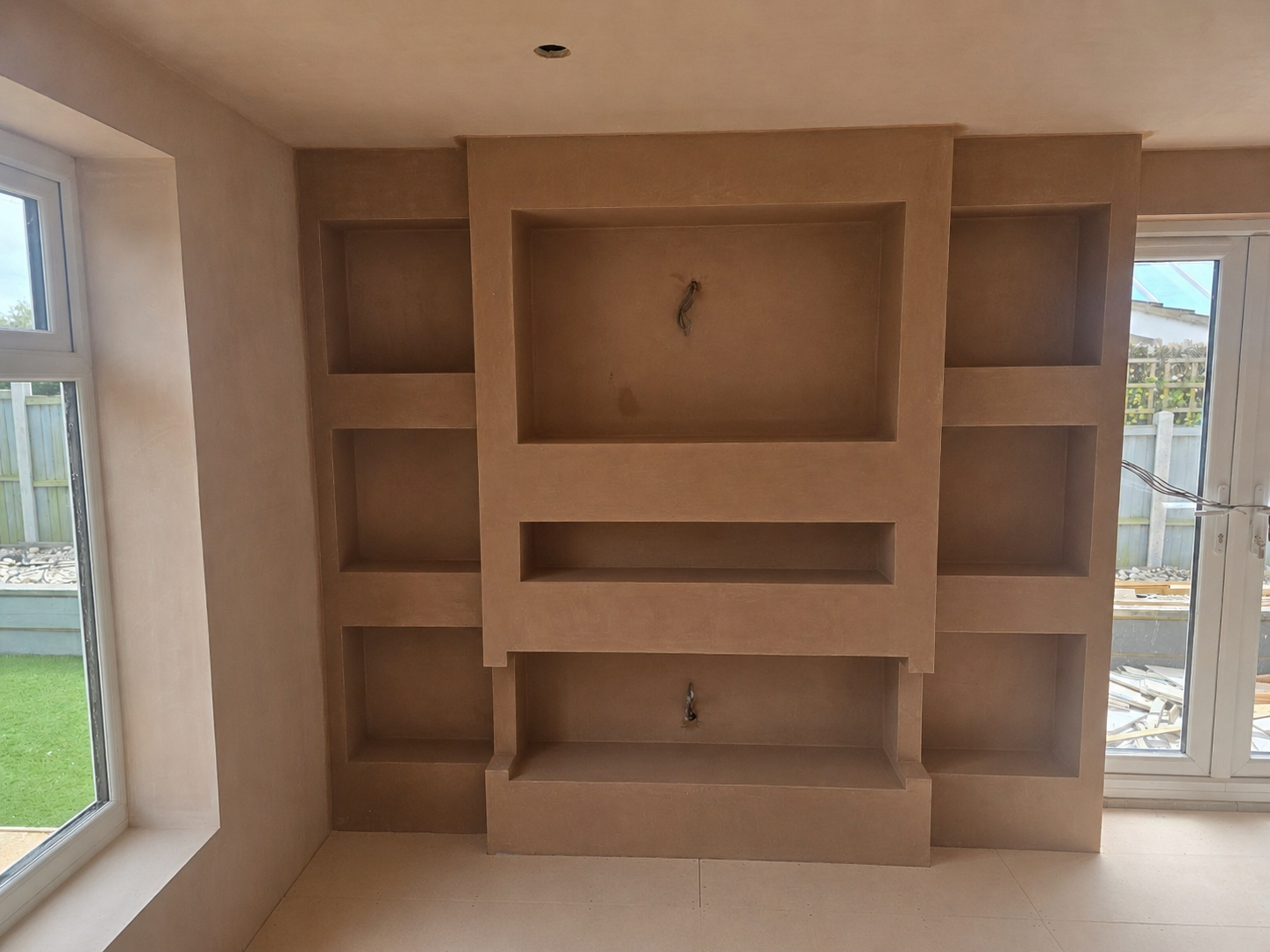 Bespoke plastered media wall completed by Ultimate Plastering