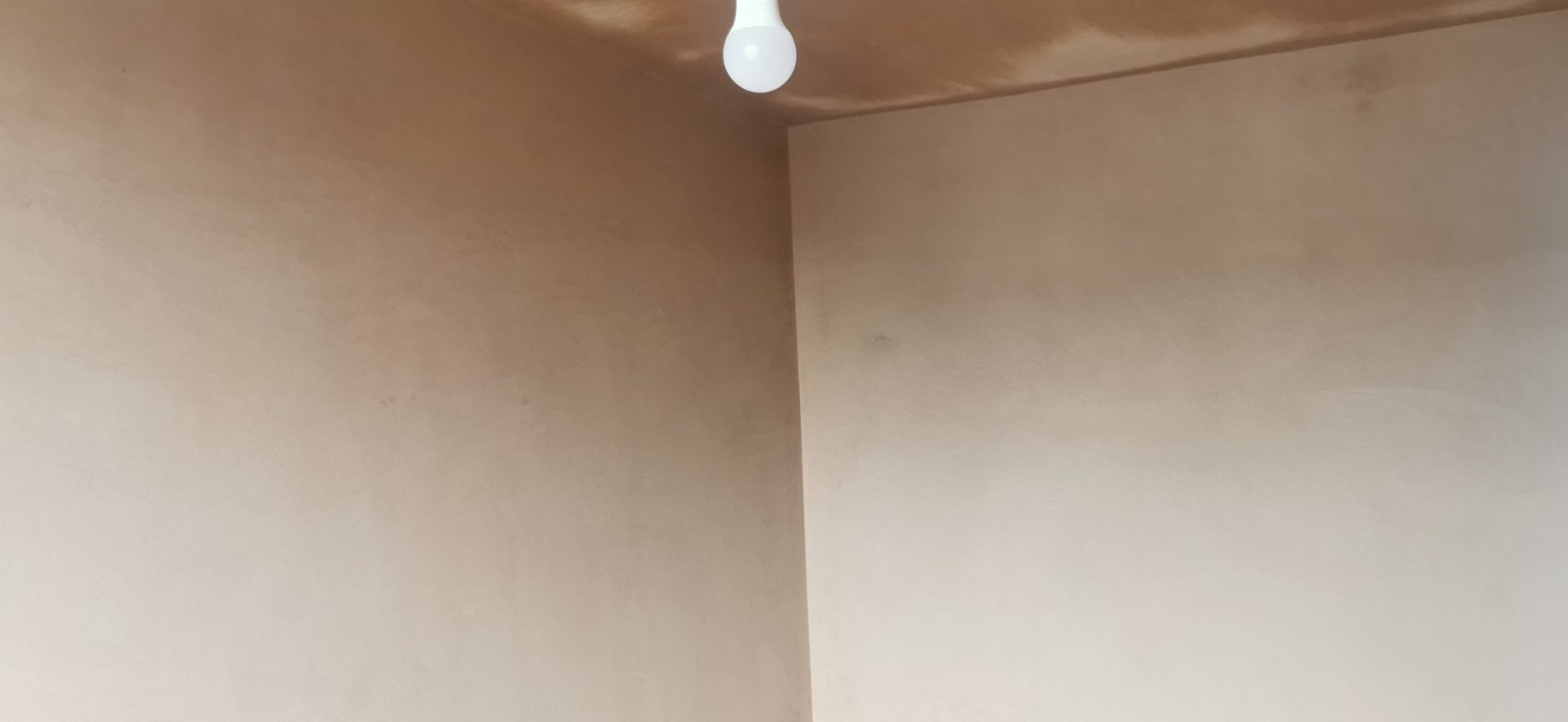 Neil plastering a wall on site