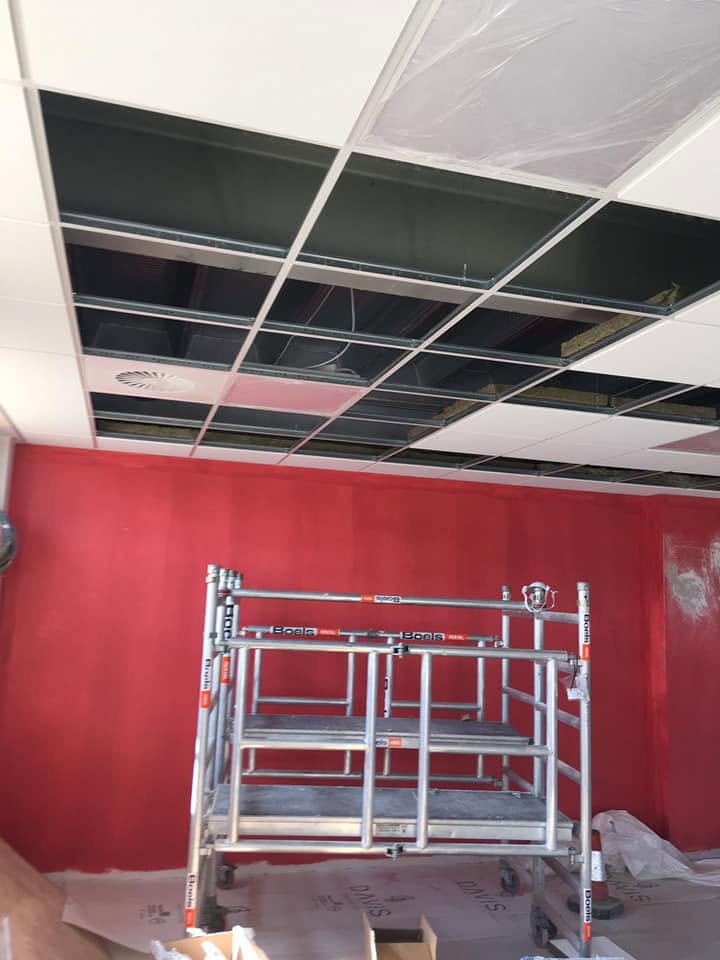 Suspended ceiling tiles and grid in a school or public building